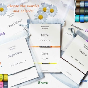 May include: Assortment of colorful bracelets with inspirational words in Morse code, including "Carpe Diem", "Success", "Strength", "Brave", "Carpe", "Diem", and "Courageous".