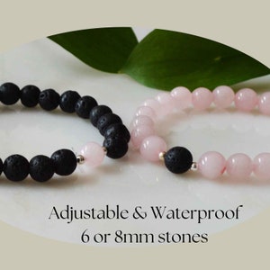 May include: Two beaded bracelets. One bracelet features black lava stones, the other has pink rose quartz beads. The bracelets are next to each other. The text "Adjustable & Waterproof 6 or 8mm stones" is at the bottom of the image.