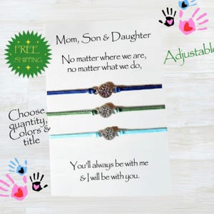 May include: Three adjustable cord bracelets in blue, green, and light blue, each with a silver-colored charm. The card reads "Mom, Son & Daughter" and includes the text "You'll always be with me & I will be with you."