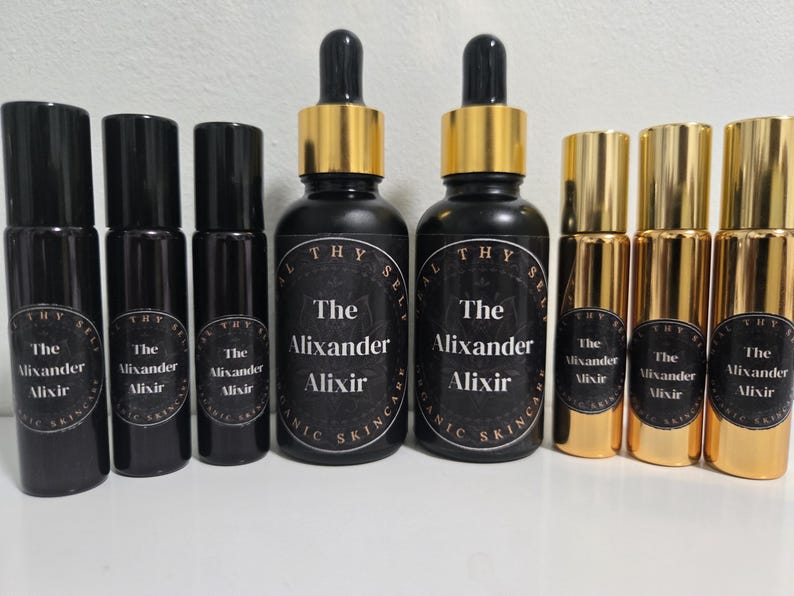May include: A set of ten 10 ml glass bottles with gold lids. The bottles are labeled "The Alixander Alixir" and "The Mixander Mixir".