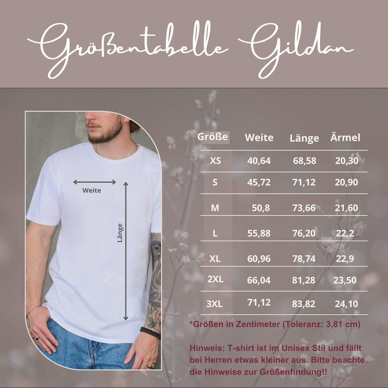 May include: A Gildan size chart for a white t-shirt featuring a table with columns for size, width, length, and sleeve measurements in centimeters. The chart includes sizes XS through 3XL and notes a tolerance of 3.81 cm for the garment dimensions.