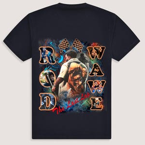 May include: A navy blue t-shirt with a colorful graphic design featuring the word "ROWAVE" in orange letters and the phrase "The Last Lap" in red. The graphic also includes images of people and checkered flags.