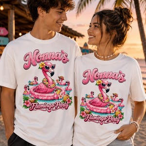 May include: A white t-shirt featuring a graphic print of a pink flamingo wearing sunglasses and a flower lei, floating in a pink inner tube. The text reads Nonna's Flamingo Party in pink lettering, surrounded by smaller flamingos, tropical flowers, and drinks.
