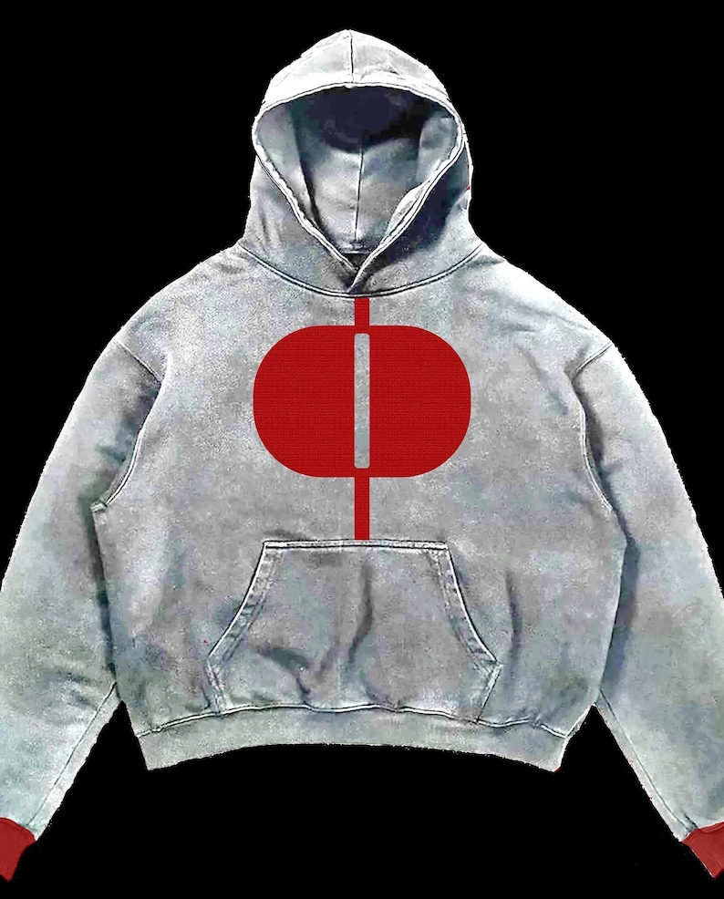 May include: A gray hoodie with a red oval and vertical line design on the front. The hoodie has a hood, a front pocket, and red cuffs. The background is black.