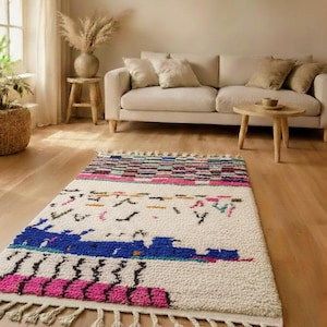 May include: A set of three ceramic mugs with a speckled, matte finish. The mugs are in shades of cream, light gray, and dark gray. Each mug has a simple, minimalist design, perfect for coffee or tea.