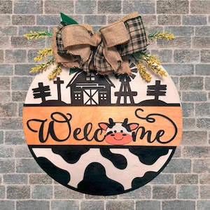 Plaque de bienvenue vache de ferme - accroche-porte de grange rustique rond de 14 po. - Décoration de porche de ferme de campagne - Panneau mural à imprimé vache avec noeud
