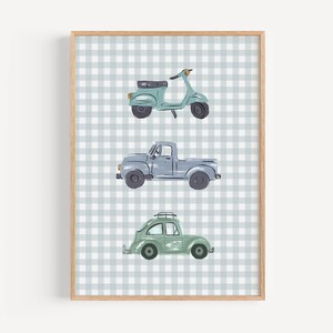 May include: Watercolor print of three vehicles: a teal scooter, a gray pickup truck, and a green car with a roof rack. The vehicles are set against a light blue and white gingham pattern background, framed in a light wood. A charming piece for a nursery or child's room.