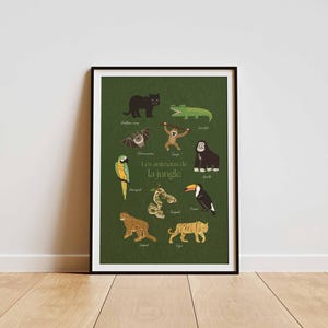 May include: Framed poster featuring jungle animals, including a black panther, crocodile, monkey, gorilla, parrot, snake, toucan, leopard, and tiger. The text "Les animaux de la jungle" is in the center. The poster is in a black frame.