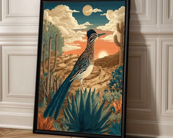 May include: Framed art print featuring a roadrunner bird in a desert landscape. The artwork showcases a vibrant sunset with cacti, agave plants, and a detailed depiction of the bird. The frame is black.