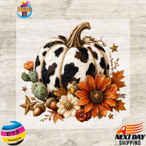 May include: A decorative graphic featuring a white pumpkin with black cow-print spots, accented by a green cactus, orange and white flowers, brown acorns, and gold stars. The design includes the text Jet Transfer DTF and Next Day Shipping.