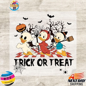 May include: A Halloween-themed graphic featuring three cartoon ducks in costumes. One is a ghost, another a devil, and the third a witch. The phrase "TRICK OR TREAT" is printed below the characters, with bats, a pumpkin, and spiderwebs.