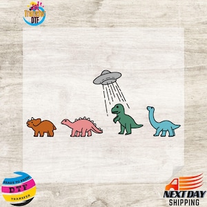 May include: A digital transfer design featuring four dinosaurs, including a triceratops, a stegosaurus, a tyrannosaurus rex, and a brachiosaurus. A flying saucer hovers above the dinosaurs, with a shower of water droplets falling from it.