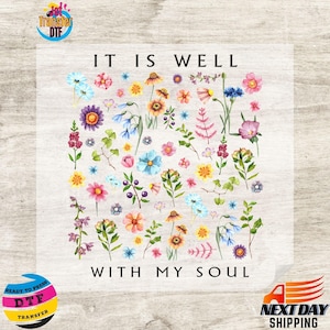 May include: A floral design with the text "IT IS WELL WITH MY SOUL." The design features a variety of colorful flowers, including daisies, roses, and wildflowers. The flowers are arranged in a scattered pattern.