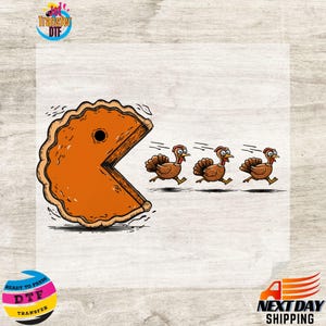 May include: A humorous graphic featuring a pumpkin pie chasing three cartoon turkeys. The pie is designed in the style of Pac-Man. The image is a DTF transfer, ready to press.