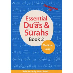 May include: A book titled "Essential Du'as & Surahs Book 2" with a blue background and white and red text. The book cover includes Arabic script and the words "Madinah Script" in a yellow circle. The book is part of the "Safar Learn by Heart Series."