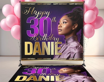 May include: A custom backdrop and floor decal set for a 30th birthday celebration. The backdrop features a woman's portrait, the text "Happy 30th Birthday DANIE" in gold and purple. Pink balloons are in the background.