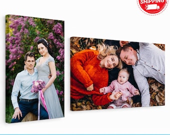 May include: Two rectangular canvas prints. The left print shows a person in a light blue shirt and a person in a grey dress standing before purple flowers. The right print shows a person in an orange sweater and a person in a grey shirt holding a baby.