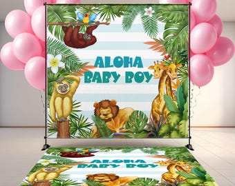 May include: A backdrop and floor decal set with a jungle theme. The backdrop features a sloth, monkey, lion, and giraffes, with the text "Aloha Baby Boy" on a blue and white striped background. Pink balloons are on the left.