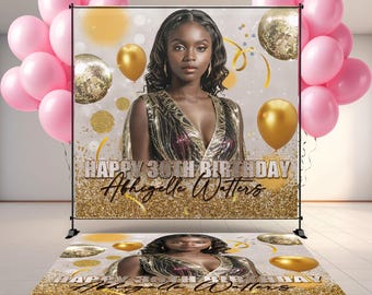 May include: A custom birthday backdrop and floor decal set. The backdrop features a woman, gold balloons, and the text "HAPPY 30TH BIRTHDAY Abigelle Watters." Pink balloons are on the left and right.