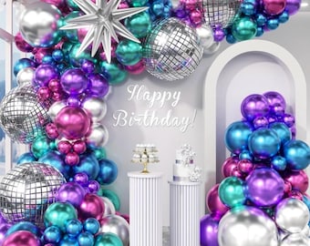 May include: A festive birthday party scene with a vibrant balloon arch in shades of teal, purple, pink, and silver. The arrangement includes disco ball accents and a large silver star. The words "Happy Birthday!" are displayed.