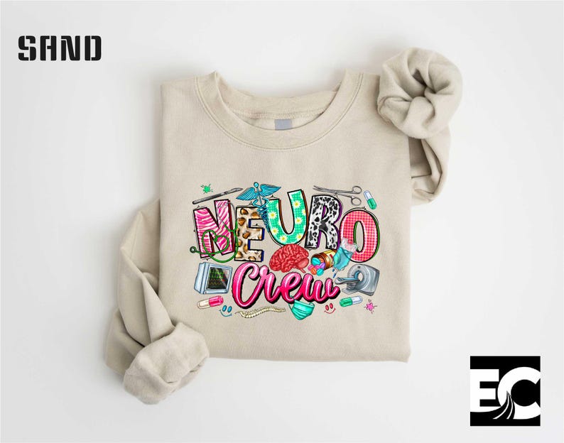 a beige t-shirt with a colorful graphic design on it, which appears to be a medical or healthcare-themed design.