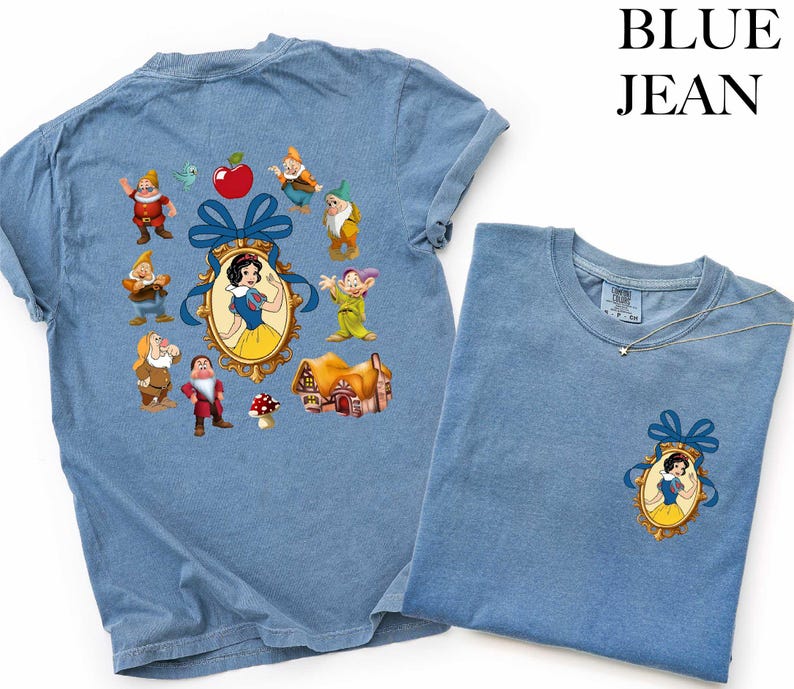 a blue t-shirt with a design of Snow White and the Seven Dwarfs, along with various other cartoon characters.