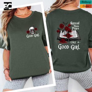 a woman wearing a green t-shirt with a skull and rose design on the front and back.