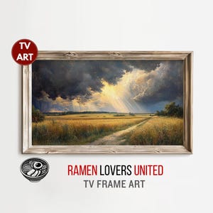 May include: A framed landscape painting depicts a field of golden wheat under a dramatic sky with dark storm clouds and beams of sunlight. The artwork is labeled "TV ART" and "RAMEN LOVERS UNITED TV FRAME ART".