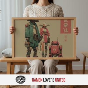 May include: A framed print featuring a futuristic illustration of three characters and a robot in a beige setting. The characters are dressed in green, pink, and white attire. The print is held by a person sitting on a wooden bench.