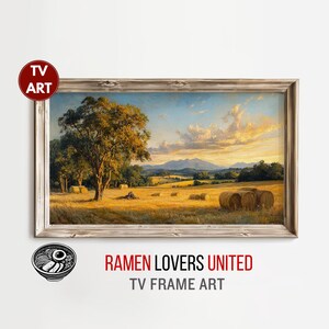 May include: A framed landscape painting shows a rural scene with a large tree, hay bales, and a field under a sunset sky. The painting is labelled "TV ART" and "RAMEN LOVERS UNITED TV FRAME ART".