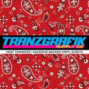 May include: Red bandana pattern with white and black paisley designs. The image features the text "TRANZGRAFIK SUPPLY CO" in blue and yellow, with the words "HEAT TRANSFER | ADHESIVE BACKED VINYL SHEETS" below.