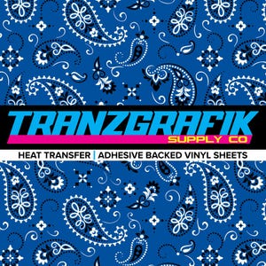 May include: Blue paisley pattern with white and black accents. The pattern is repeated throughout the image. The text "TRANZGRAFIK SUPPLY CO" is at the bottom of the image. The text "HEAT TRANSFER | ADHESIVE BACKED VINYL SHEETS" is below the company name.