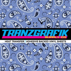 May include: A seamless pattern of paisley designs in white, black, and blue. The background is a light blue. The image includes the text "TRANZGRAFIK SUPPLY CO" and "HEAT TRANSFER | ADHESIVE BACKED VINYL SHEETS".