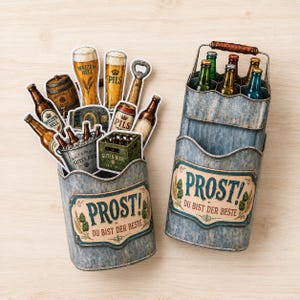 May include: Two galvanized metal beer caddies with the word "PROST!" and "DU BIST DER BESTE" on the front. One caddy holds beer bottles and glasses, the other holds bottles and a small wooden crate of beer. The caddies have a rustic, vintage look.
