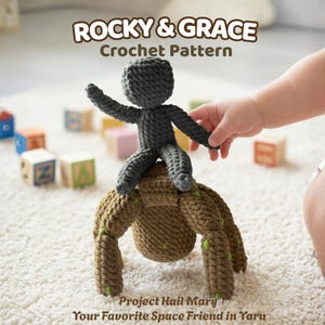 May include: A crocheted doll of a character from the movie, "Guardians of the Galaxy", with the text "ROCKY & GRACE Crochet Pattern". The doll is gray and brown, with green accents. The doll is being held by a child's hand. The text "Project Hail Mary Your Favorite Space Friend in Yarn" is also visible.