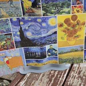 May include: A partially assembled 1500-piece jigsaw puzzle featuring artwork by Vincent van Gogh. The puzzle includes images of sunflowers, self-portraits, and landscapes. The puzzle is displayed on a wooden surface.