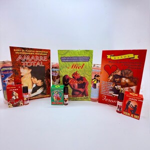 May include: An assortment of products, including boxes, bottles, and rolled items, with text in Spanish. The items feature images of couples, hearts, and other graphics. The color palette includes red, green, and gold.