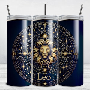 Puede incluir: Un vaso de acero inoxidable con fondo azul marino y detalles dorados. El vaso presenta una ilustración estilizada de una cabeza de león con un diseño de constelación y la palabra "Leo".