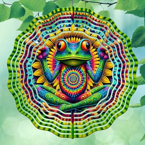 May include: A colorful, psychedelic frog wind spinner. The frog is in a meditative pose, with a tie-dye pattern on its body. The background is a sunflower with layered, wavy, green and white edges. The overall design is vibrant and eye-catching.
