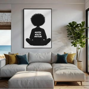 May include: Black and white illustration of a person with an afro sitting in a meditative pose. The person is wearing a black sweatshirt with the text "Mental Health Matters" printed on it.