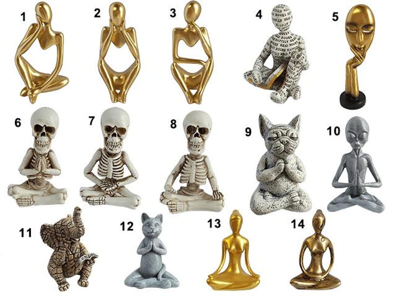 May include: A collection of 14 figurines in various poses, including a skeleton, a cat, an elephant, and an alien. The figurines are made of different materials, including gold, silver, and white.