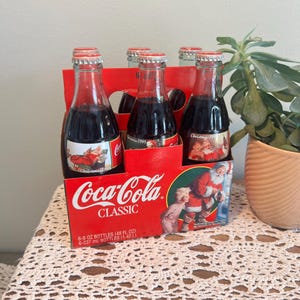 Vintage Christmas 1995 Santa Coca Cola Lot of 6 Glass Bottles W