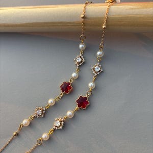 Brillenketting met rode bloemen, lenzenvloeistofketting parel, lenzenvloeistofketting, zonnebrilketting