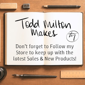 May include: Open notebook with the text "Todd Milton Makes" and a circular logo. Below, the text reads "Don't forget to Follow my Store to keep up with the latest Sales & New Products!" on a wooden surface.