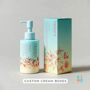 Puede incluir: Un frasco con bomba azul claro y una caja a juego, ambos etiquetados como "Frenava natural & organic Cleansing Cream". El embalaje presenta ilustraciones bot&aacute;nicas en naranja y blanco. El texto "CUSTOM CREAM BOXES" est&aacute; en la parte inferior.