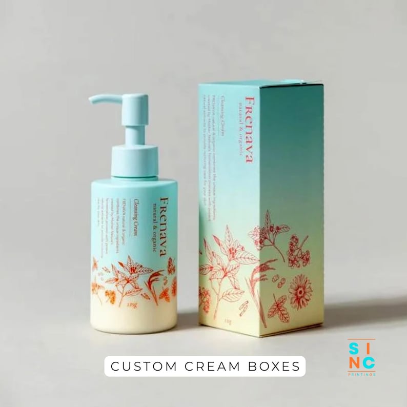 Puede incluir: Un frasco con bomba azul claro y una caja a juego, ambos etiquetados como "Frenava natural & organic Cleansing Cream". El embalaje presenta ilustraciones bot&aacute;nicas en naranja y blanco. El texto "CUSTOM CREAM BOXES" est&aacute; en la parte inferior.