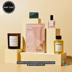 Puede incluir: Una exhibición de productos de belleza que incluye una vela, una mascarilla facial, un perfume y una botella de aceite. La vela está etiquetada como "seaweed and samphire". La mascarilla facial está etiquetada como "SMARTMUD DETOX". El perfume está etiquetado como "green". La botella de aceite está etiquetada como "VERDEN".