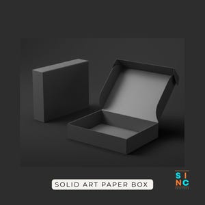 May include: A white ceramic mug with a black handle and the text "But First, Coffee" in a handwritten style. The mug is on a white surface. The mug is approximately 4 inches tall.