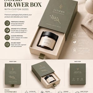 May include: An open olive green drawer box with a beige interior, holding a jar of face cream. The box has the text "SOLID DRAWER BOX" and "LUVÉRA BOTANICAL SKINCARE". The box is designed for premium packaging and has custom sizes.