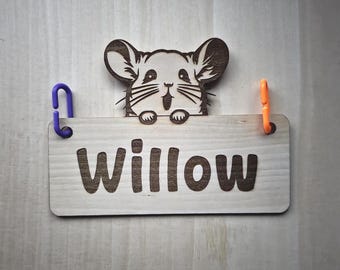 May include: Wooden sign with the name "Willow" engraved in dark brown letters. A laser-cut mouse peeks over the top of the sign. The sign is attached with a purple clip on the left and an orange clip on the right.
